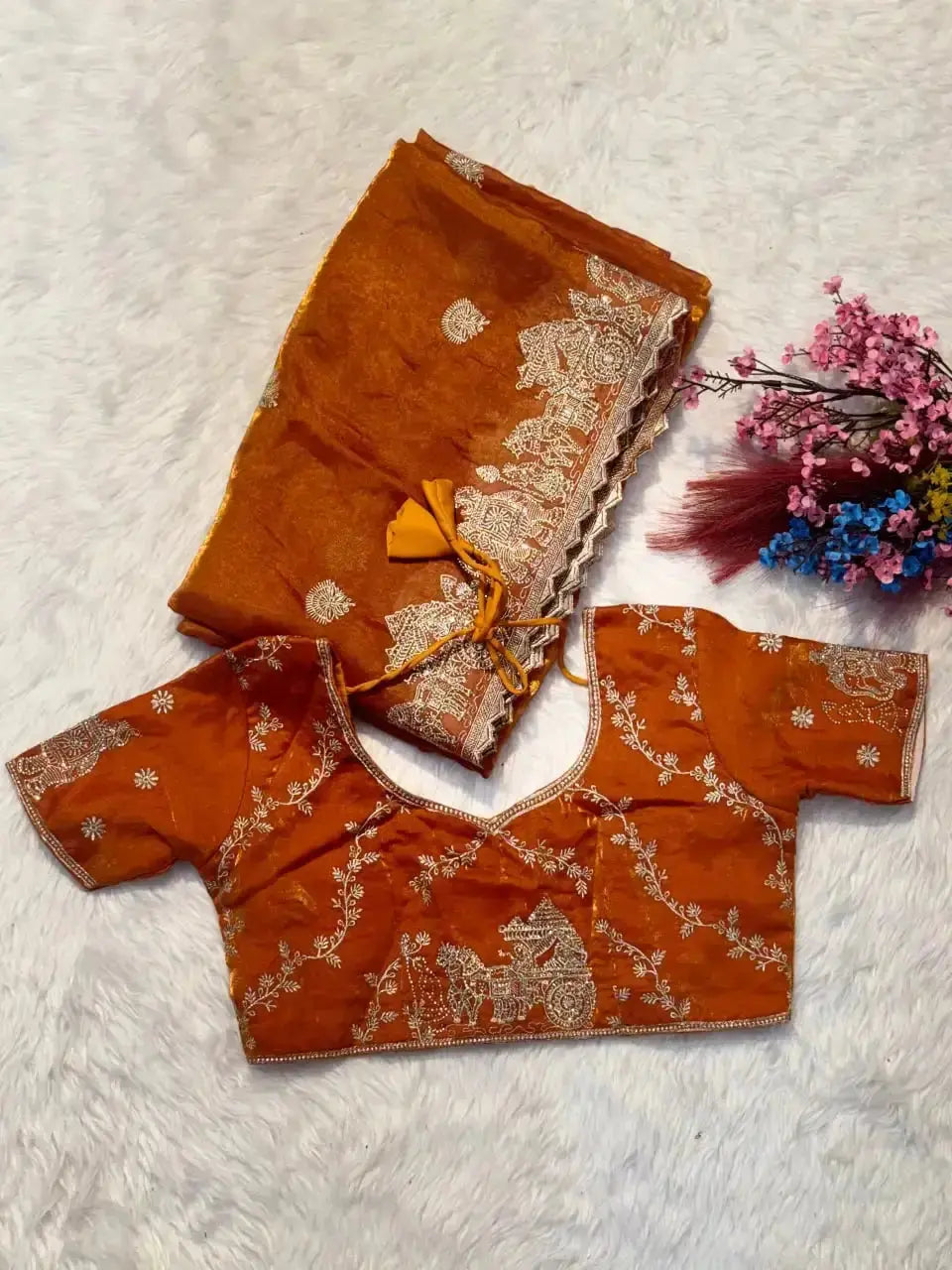 Orange Zari Embroidered Saree flat lay with matching blouse piece