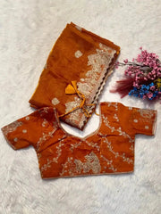 Orange Zari Embroidered Saree flat lay with matching blouse piece