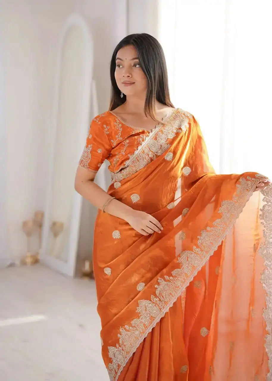 Orange Zari Embroidered Saree portrait view looking away