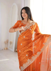 Orange Zari Embroidered Saree portrait smiling at camera
