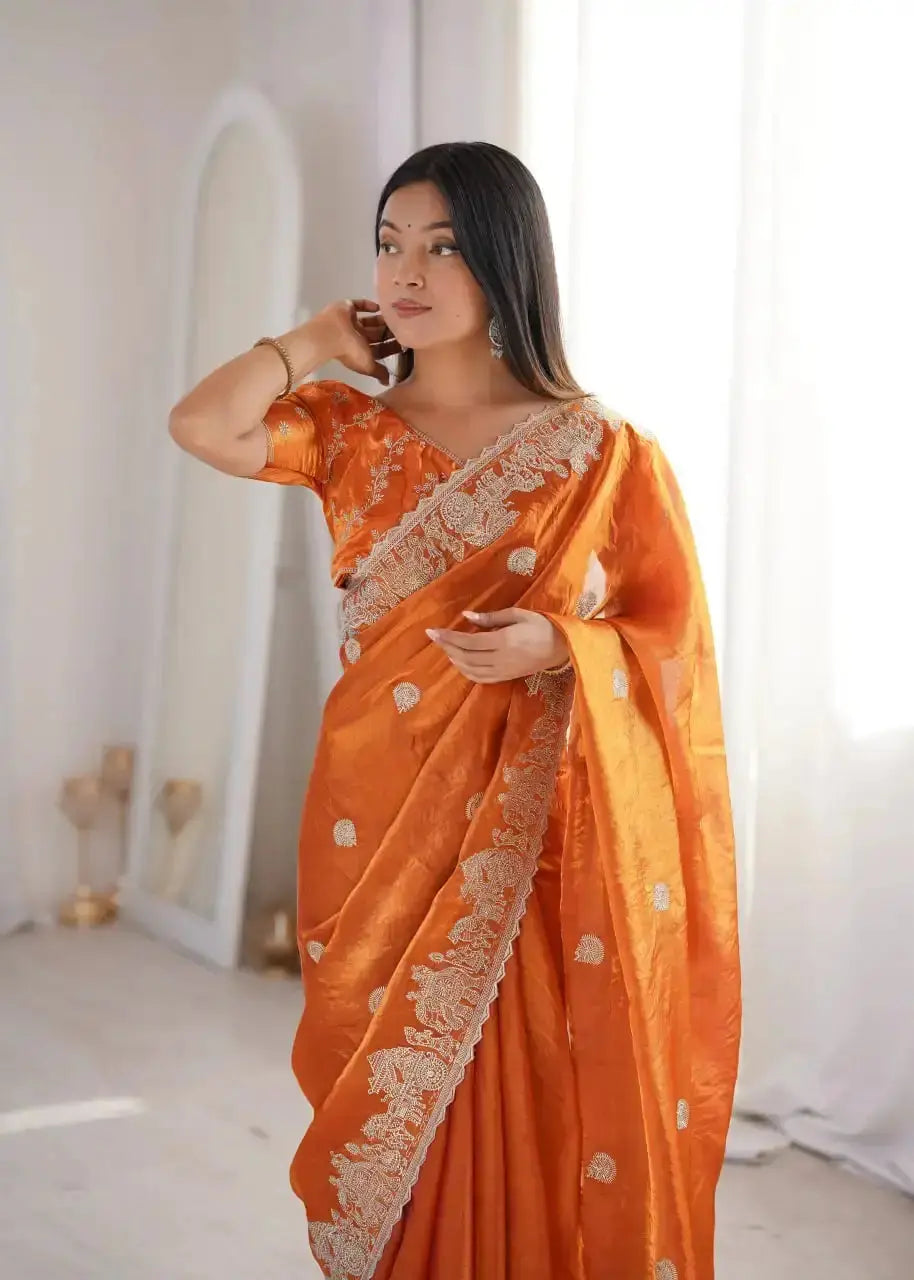 Orange Zari Embroidered Saree portrait view with hand near face