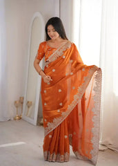 Orange Zari Embroidered Saree portrait looking down smiling