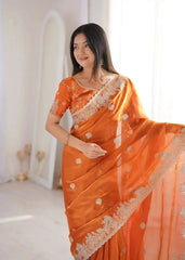 Orange Zari Embroidered Saree close-up portrait looking away
