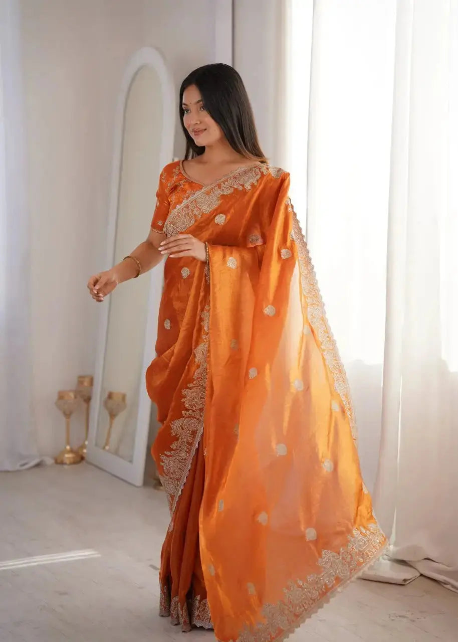 Orange Zari Embroidered Saree side profile smiling view