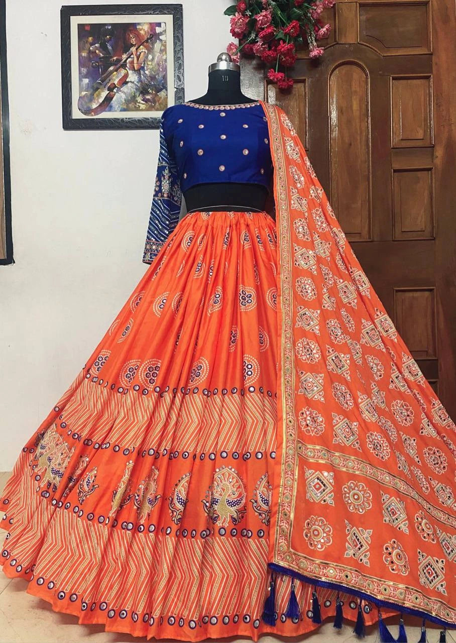 Traditional orange and blue outfit on a mannequin against a wooden door and wall.