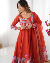 Woman wearing a red floral traditional outfit with a white background