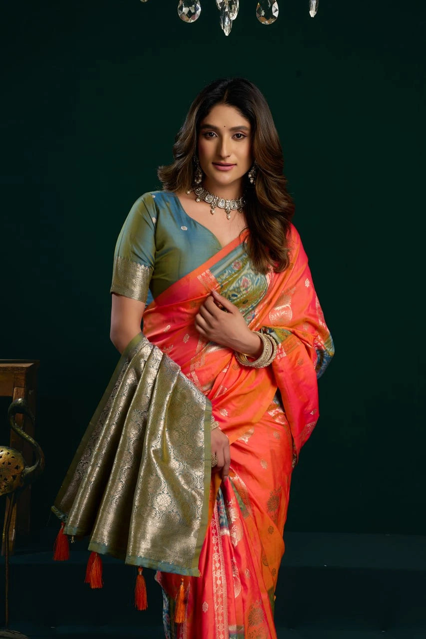 Woman in a colorful saree against a dark background