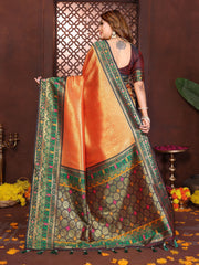 Luxurious soft pure Banarasi tissue silk saree in orange shade featuring traditional zari patterns.