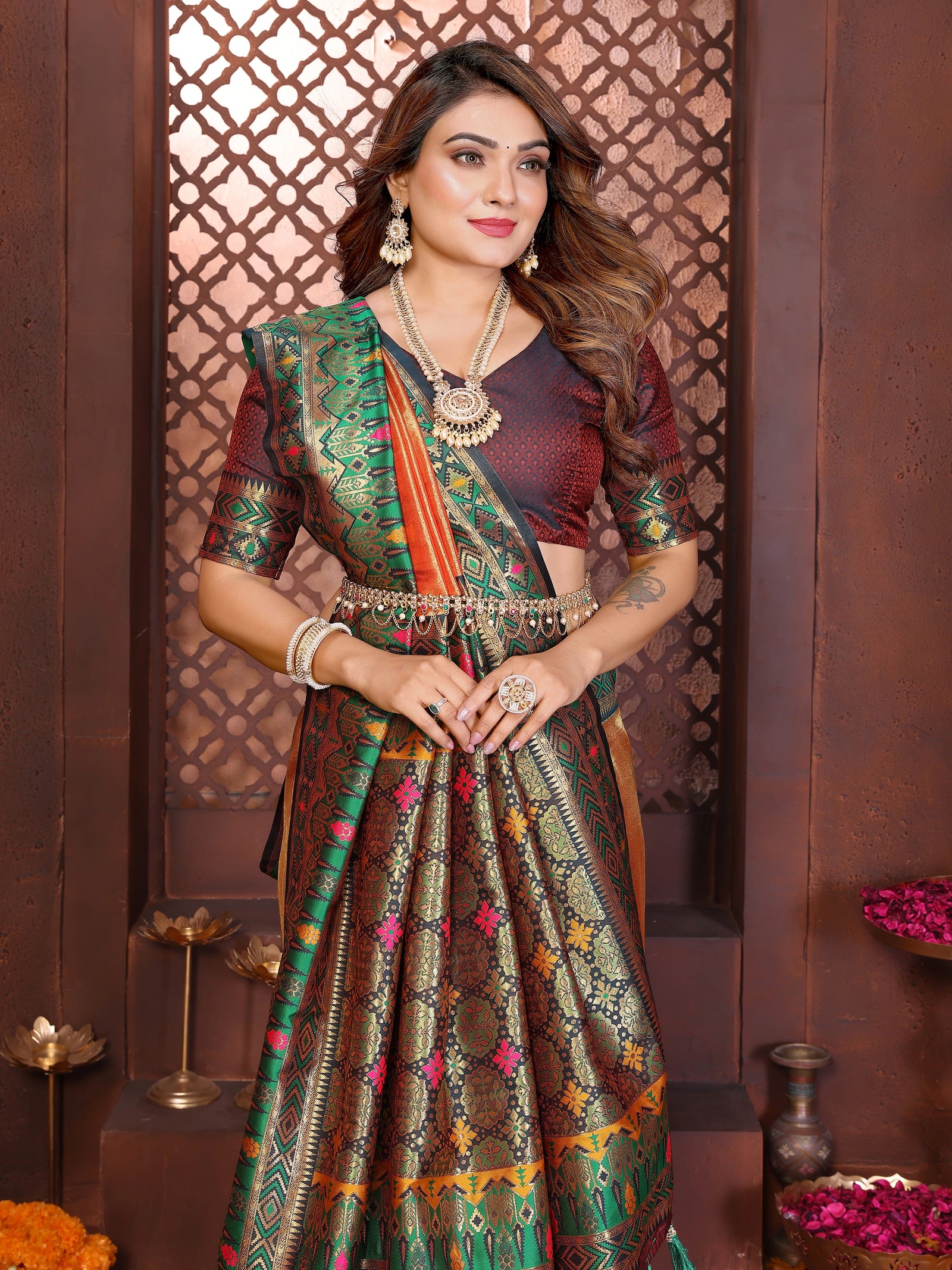 Luxurious soft pure Banarasi tissue silk saree in orange shade featuring traditional weaving design.