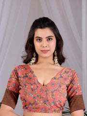 Woman wearing a floral blouse with a plain background
