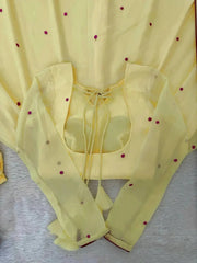 Elegant Pastel Yellow Ethnic Suit Set with Floral Neck Embroidery, Dotted Dupatta, and Graceful Flared Design