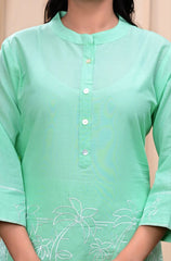 Light green kurta with floral embroidery on a neutral background