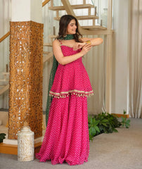 Pink Bandhej Print Suit front view model with gold bangles and green dupatta
