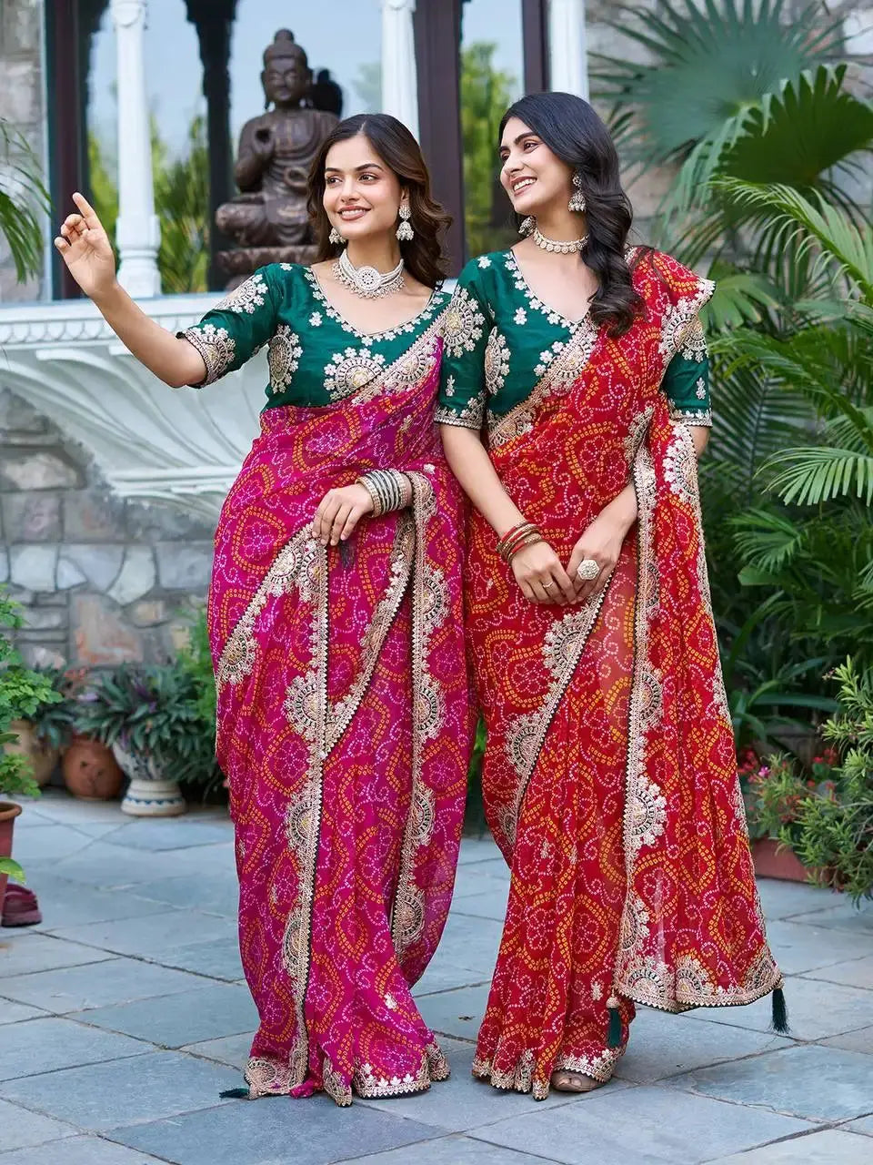 Two models posing in Pink and Red Gota Patti Sarees with zari border
