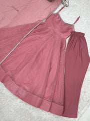 Pink Swarovski suit and pant set laid flat