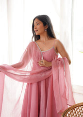 Close portrait in pink Swarovski suit with lace neckline