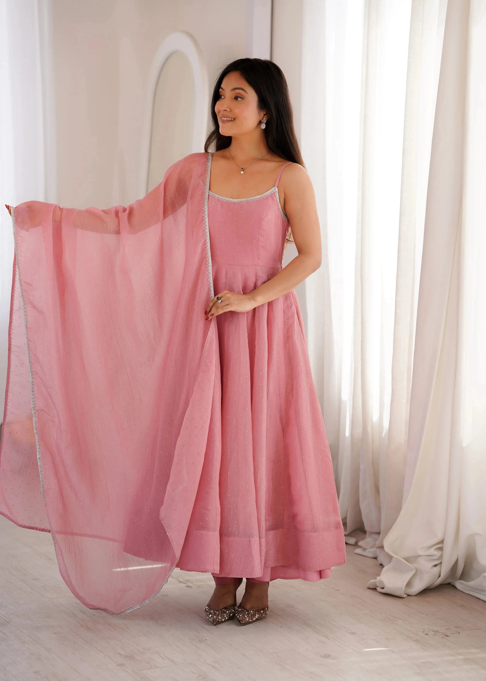 Pink Swarovski anarkali suit, side view showing flare