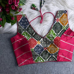 Traditional multicolor Ajrak-print blouse featuring vibrant geometric and floral motifs in orange, pink, blue, green, and red. The blouse has a deep V-neckline, black silk side panels with metallic silver stripes, and a patterned tasseled tie-back, displayed flat on a white fur background with artificial pink flowers on the side.
Related
File name: whatsapp-image-2025-06-18-at-11-32-40
Alt text: A recent WhatsApp image captured on June 18, 2025, showing a vibrant scene