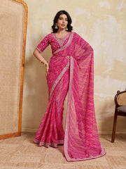 Woman wearing a pink saree with a white background