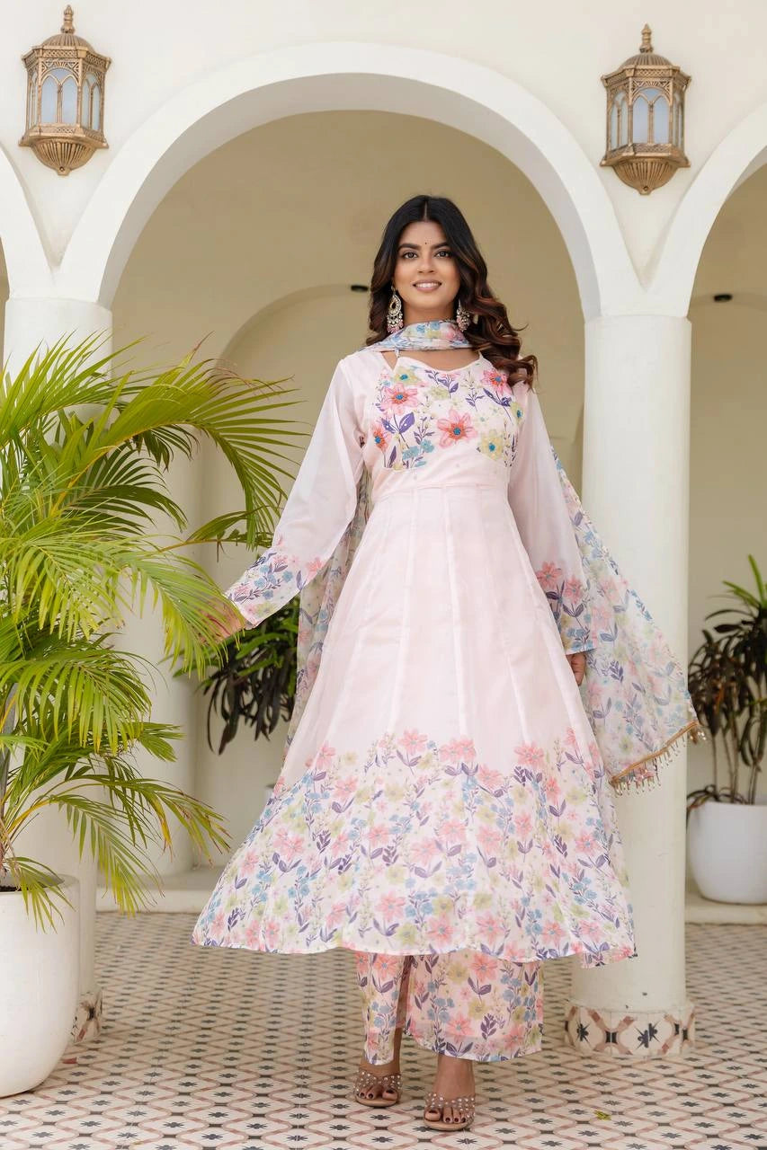 Elegant pastel pink ethnic gown with multicolor floral print and beautiful embroidered look.