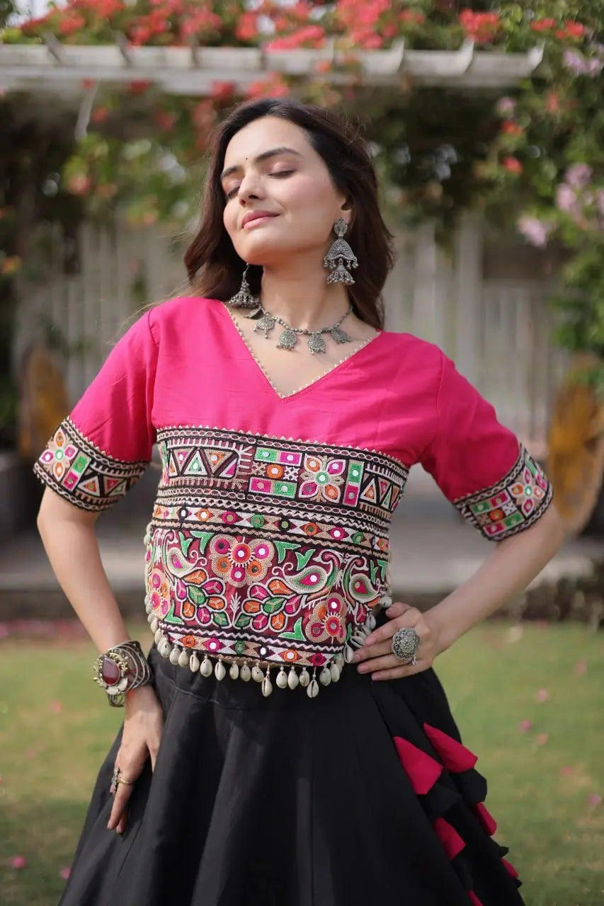 Designer Black Lehenga Set featuring Hot Pink Embroidered Blouse, Multicolor Artisan Motifs, and Contrast Border
