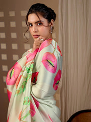 Woman wearing a floral saree with a neutral background