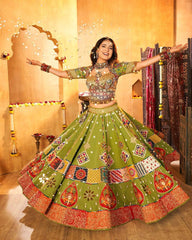 Woman in a traditional green and red embroidered outfit with a decorated background