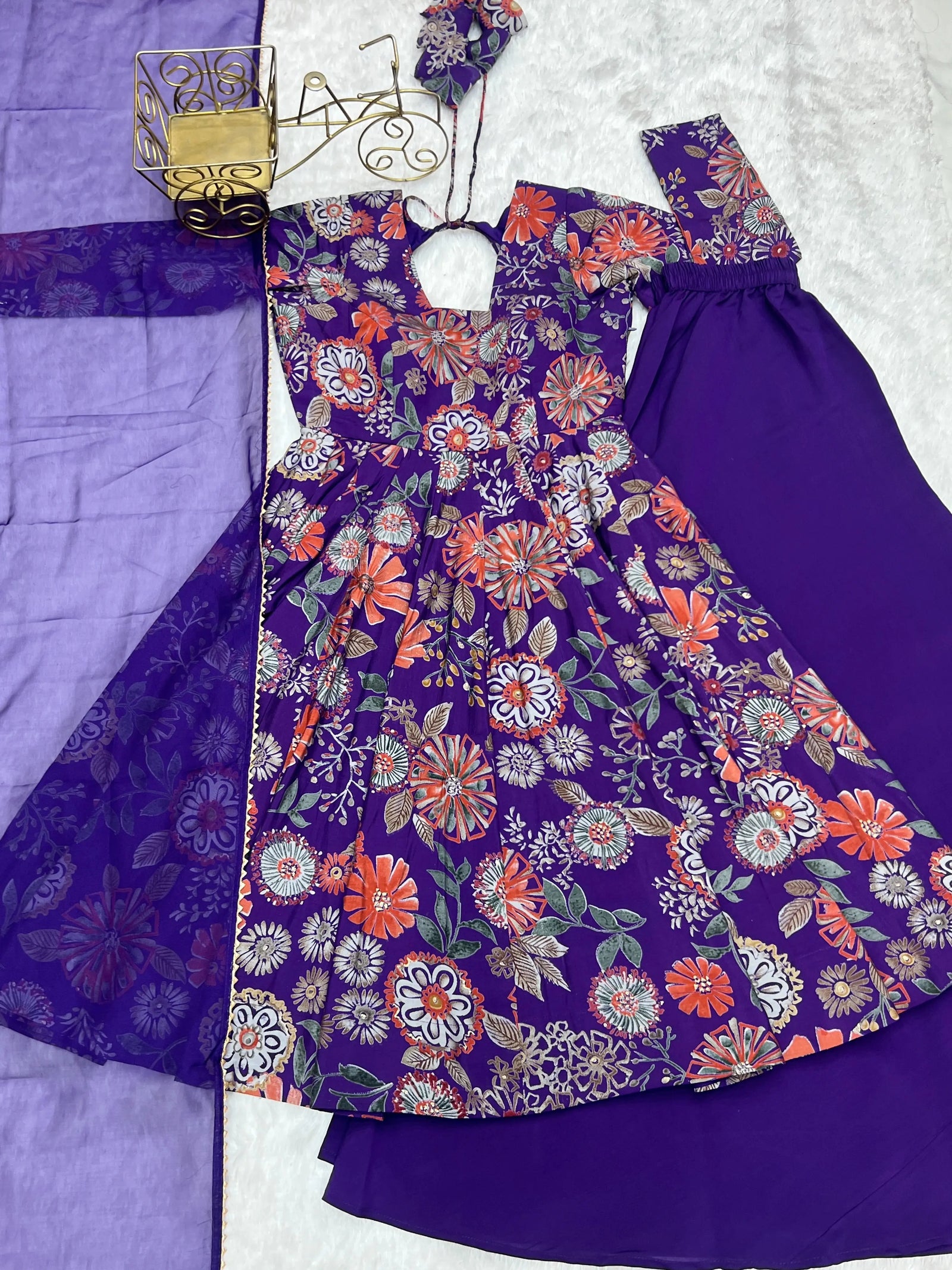 Purple Discharge Print Suit flat lay showing kurta, palazzo and dupatta set
