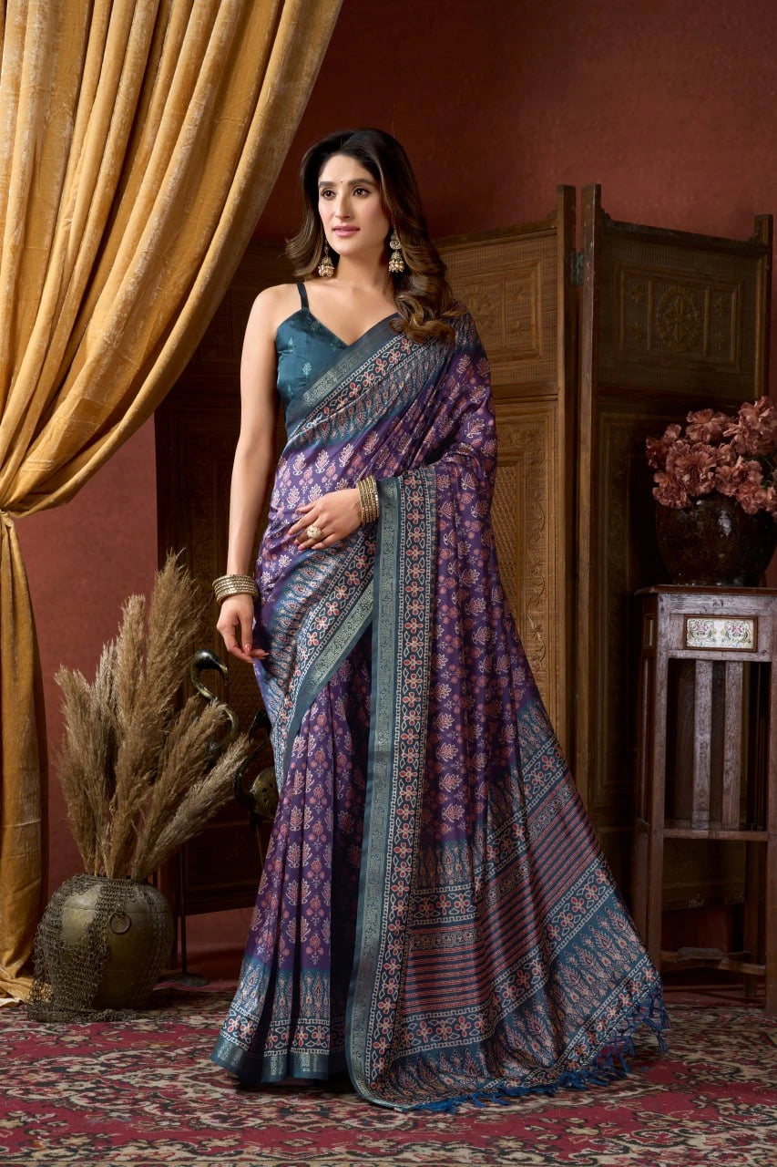 Woman wearing a traditional saree in a room with decorative elements