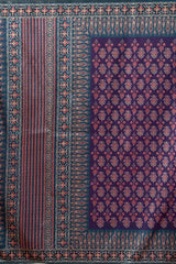 Decorative fabric with intricate patterns in purple and red