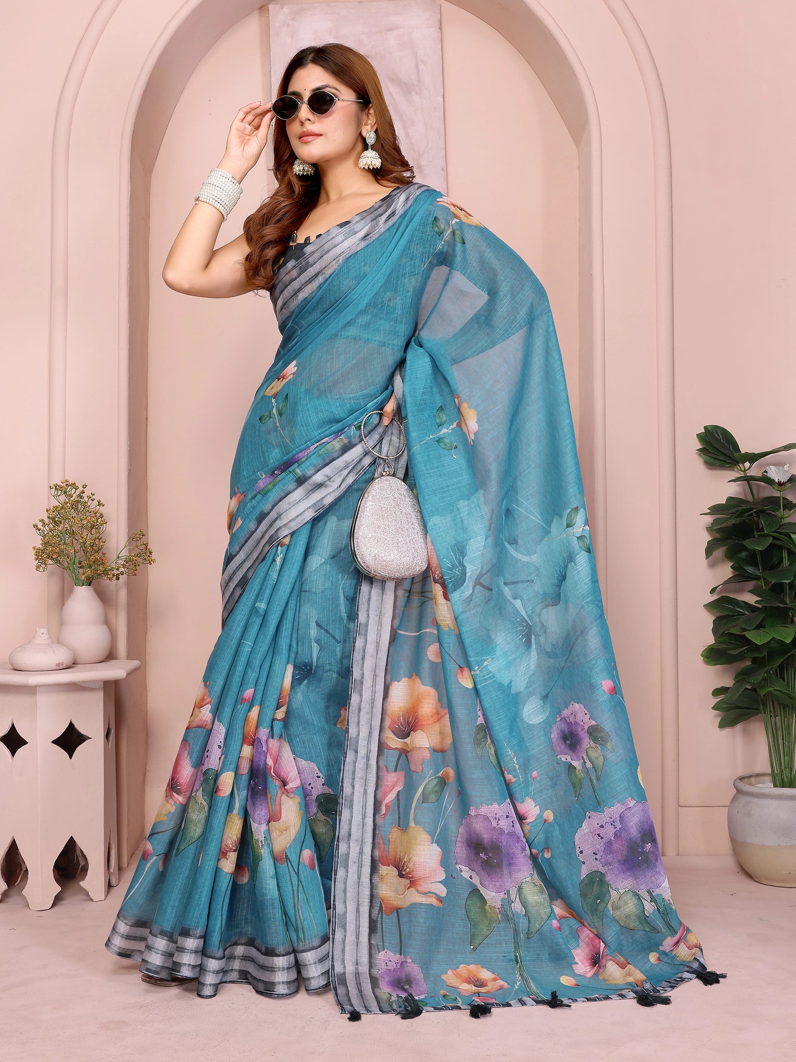 Rama Blue Linen Cotton Saree – action shot with large poppy and pansy floral print and contrast grey border