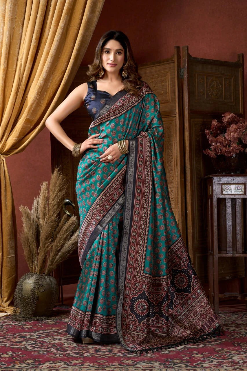 Woman wearing a traditional saree in a decorative indoor setting