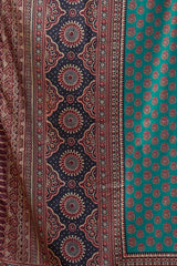 Patterned fabric with intricate designs in red, blue, and green.