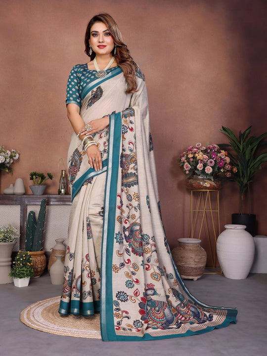 Woman wearing a traditional saree with a floral pattern in a decorated room.