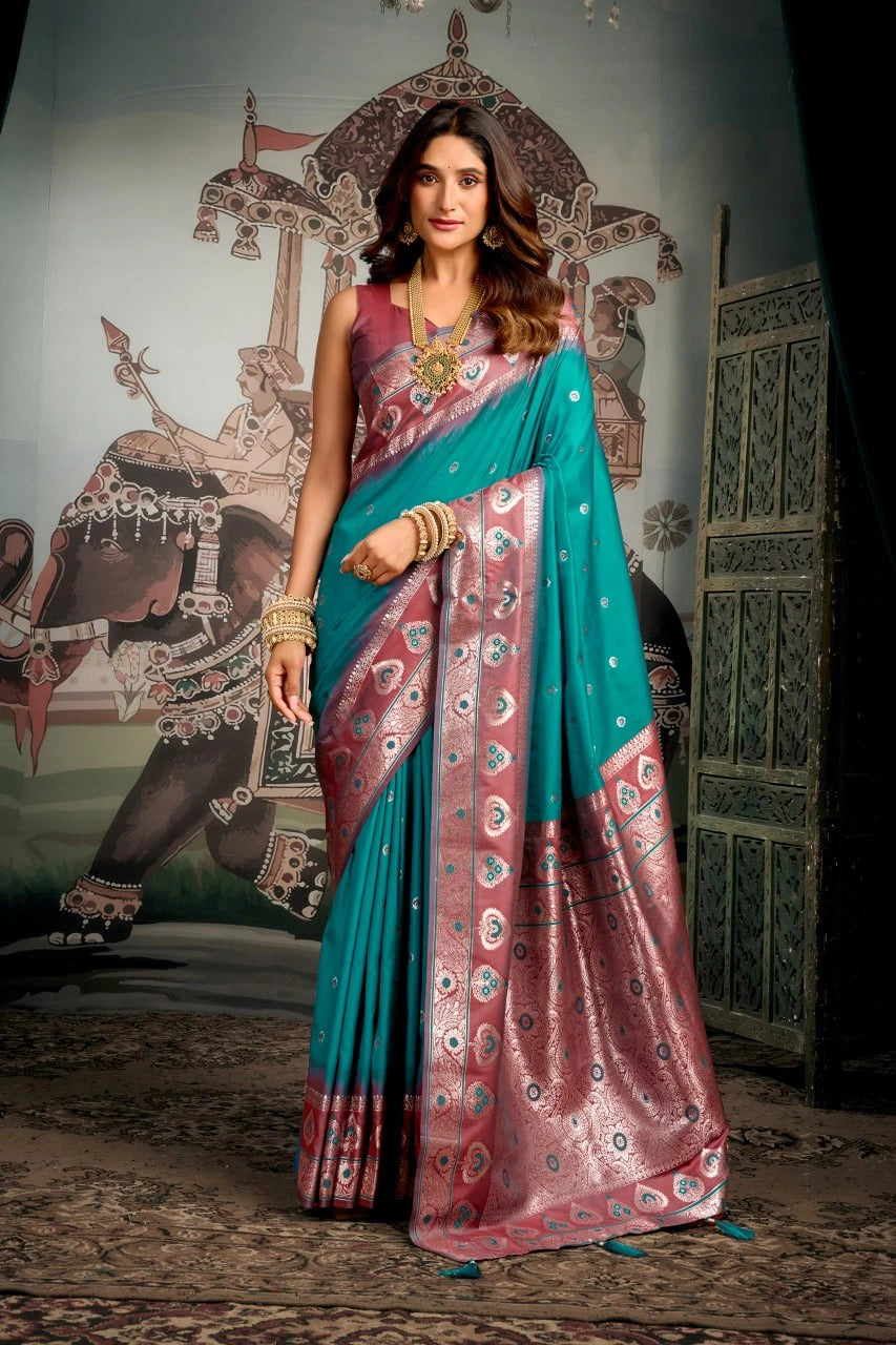 Woman wearing a traditional saree in a decorative setting