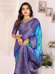 Woman wearing a blue and purple saree with a white background