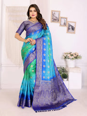 Woman wearing a blue and green saree with a white background