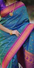 Woman wearing a colorful saree with a blurred background