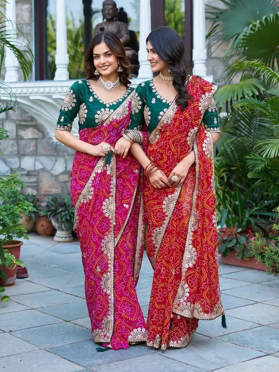 Two models in matching Gota Patti Sarees holding hands