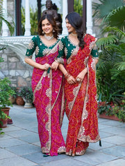 Two models in matching Gota Patti Sarees holding hands