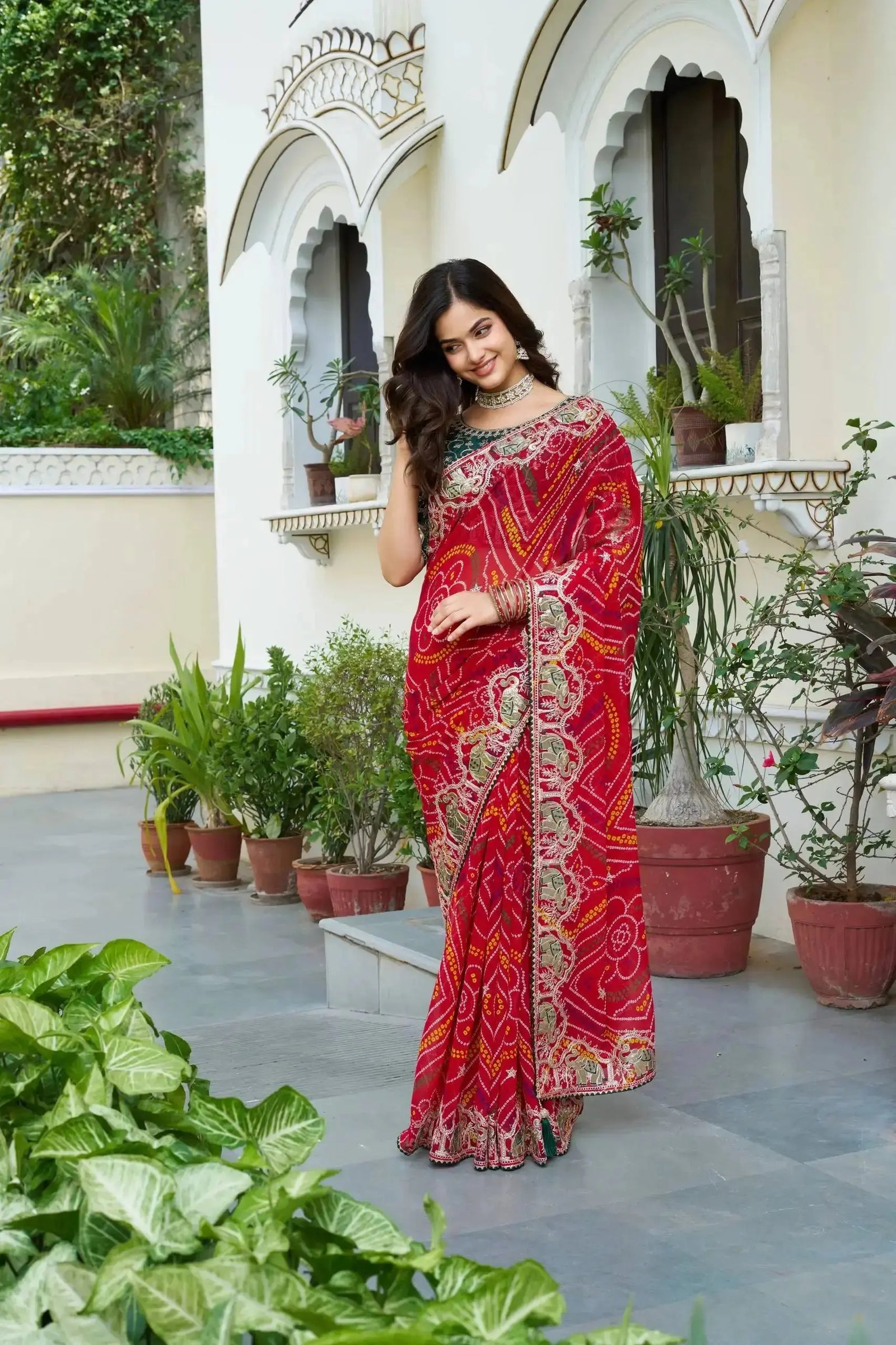 Red Gota Patti Saree draped view showing Bandhani print and green mono silk blouse