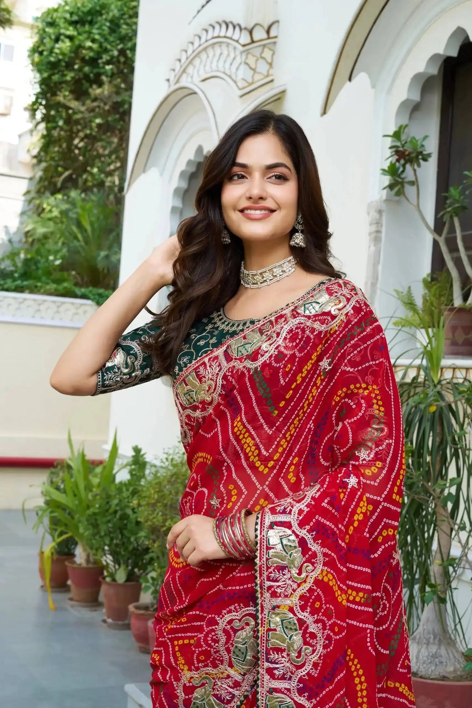 Model wearing Red Gota Patti Saree with kundan choker and jhumka earrings