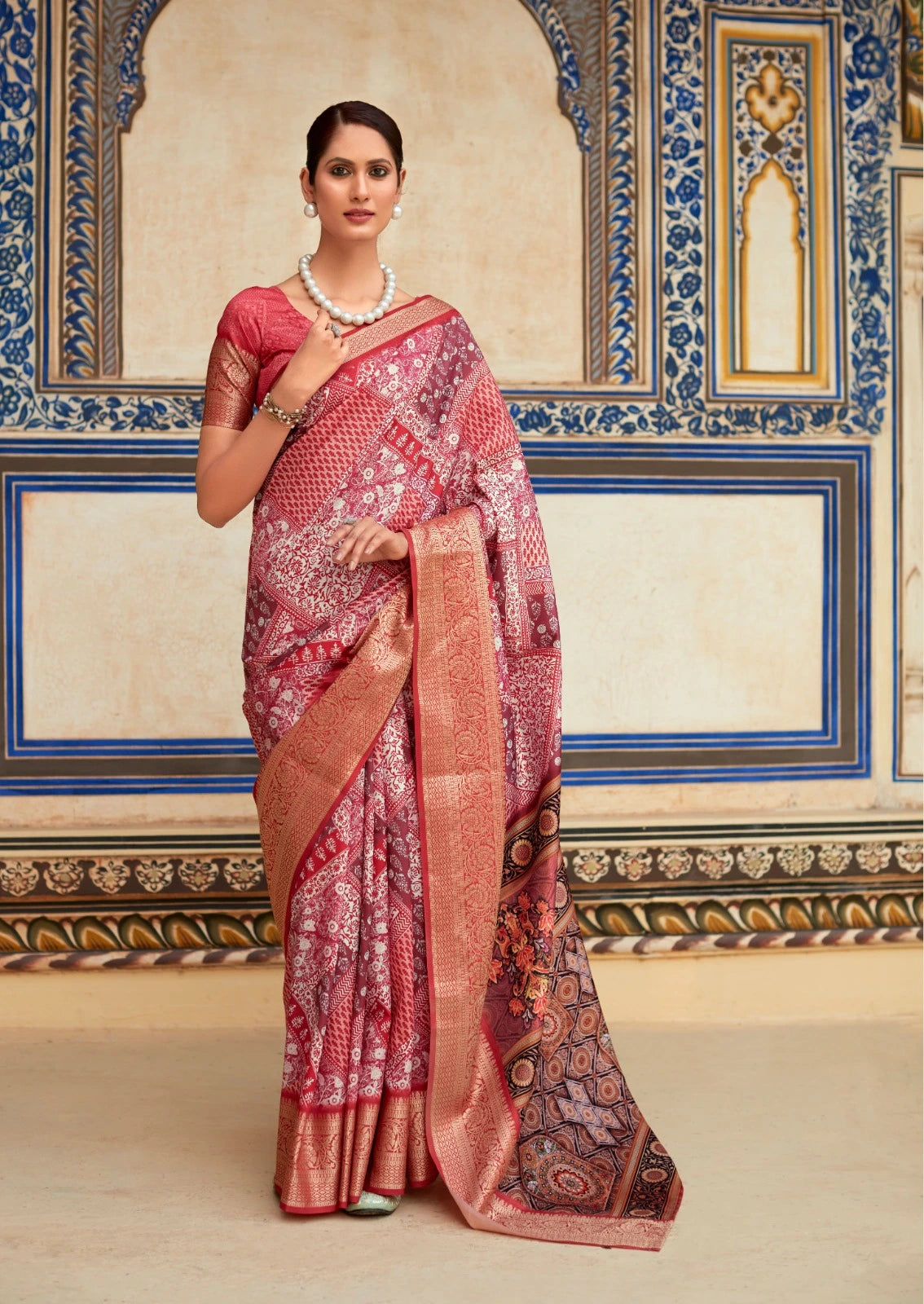 Woman wearing a traditional saree in a decorated interior setting