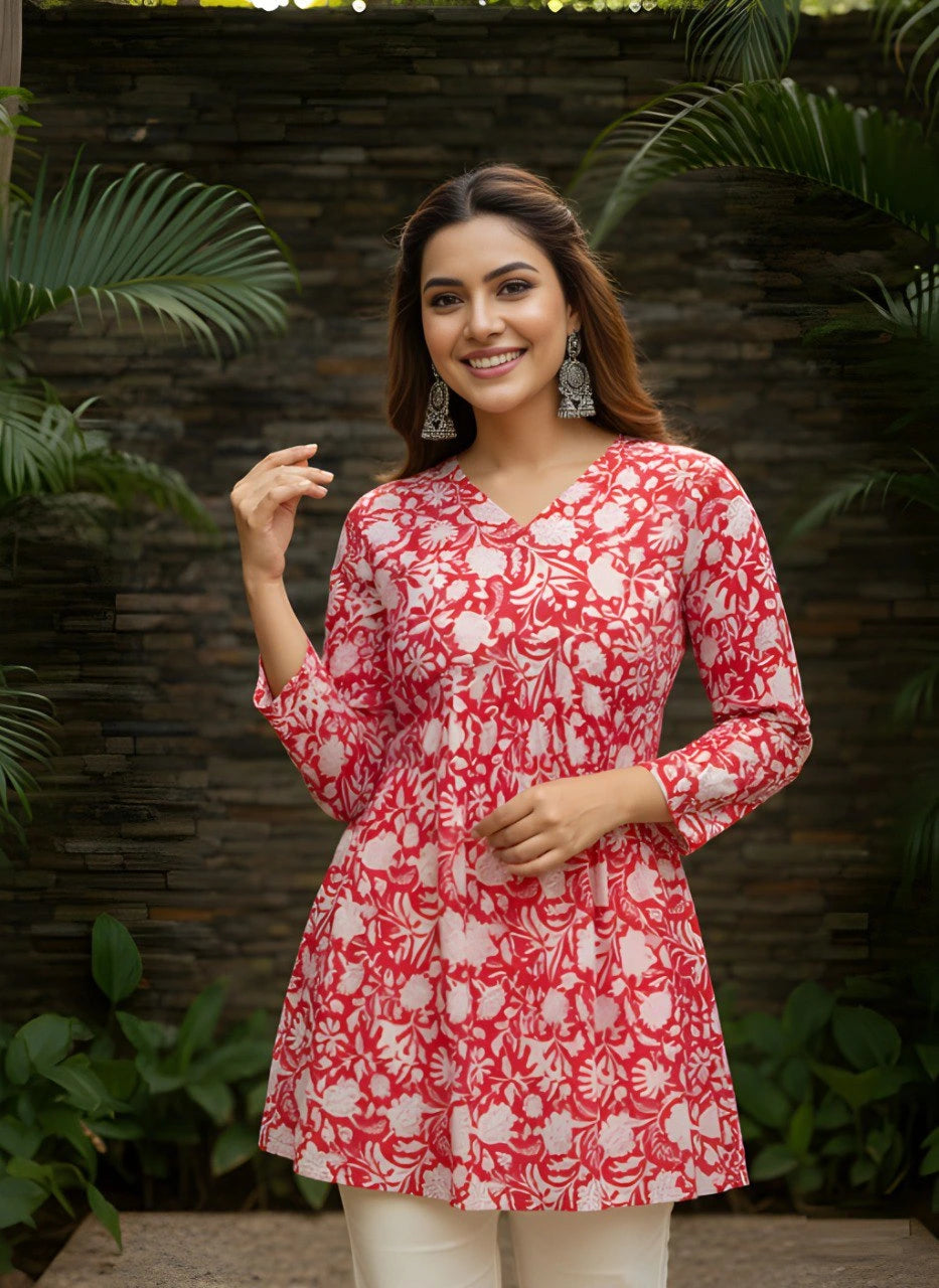 Red cotton short kurti with vibrant digital floral print, round neckline, and 3/4th sleeves — stylish casual wear for everyday comfort