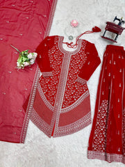 Red embroidered traditional outfit with white patterns on a white background