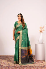 Woman wearing a green saree with a white background