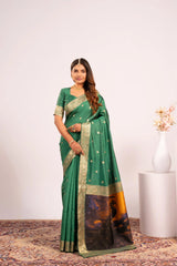 Woman wearing a green saree with a white background
