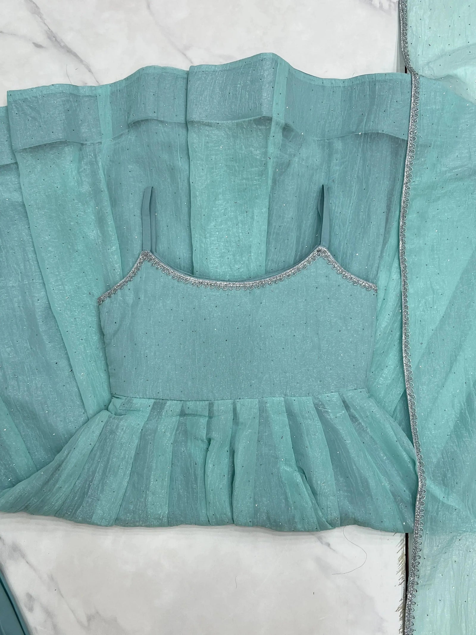 Sky blue Swarovski suit U-back design detail