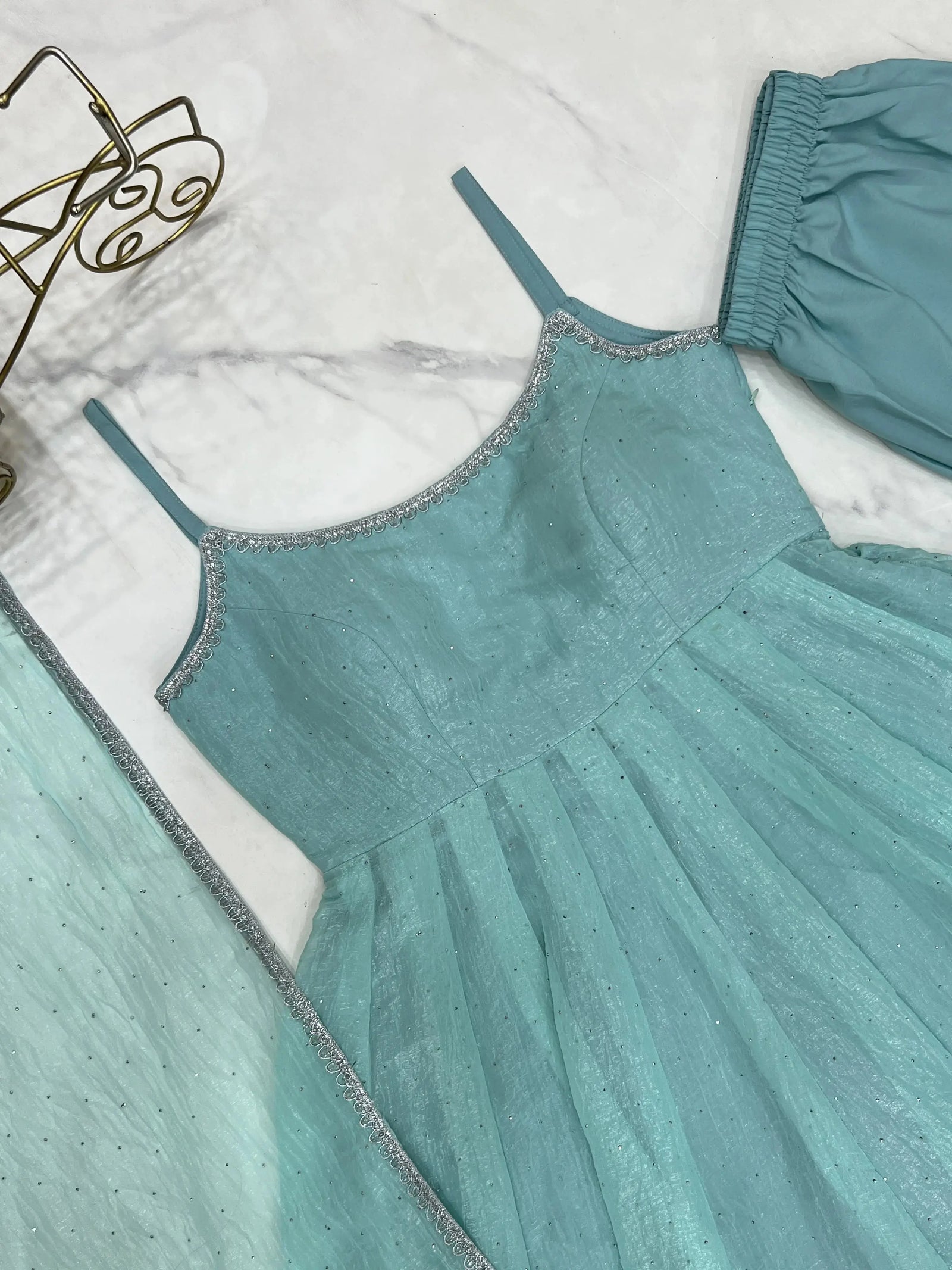 Sky blue Swarovski suit bodice with silver scalloped lace trim, detail shot