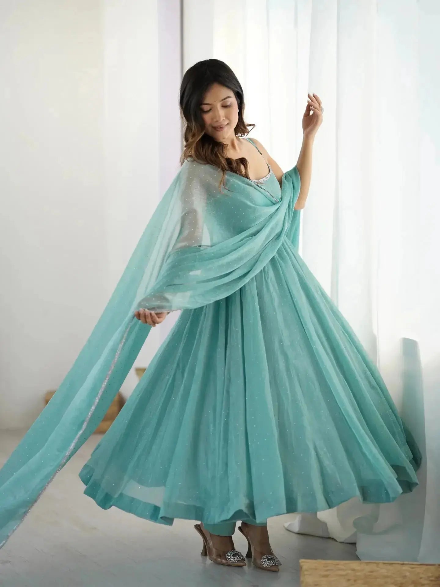 Sky blue Swarovski suit flared skirt in motion, close view